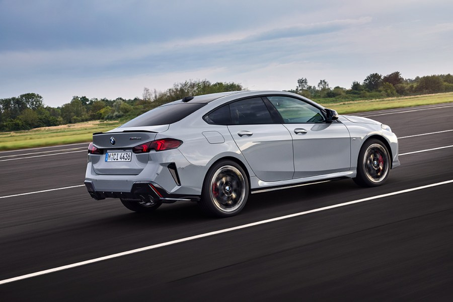 rear 3/4 driving shot of BMW M235